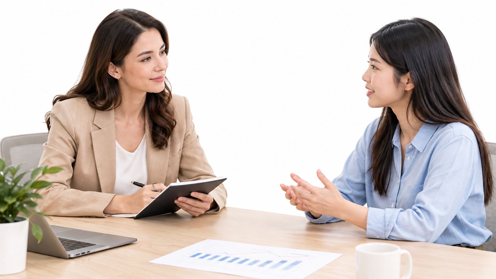 A professional woman interviewing a candidate in a bright modern office setting for a job application.