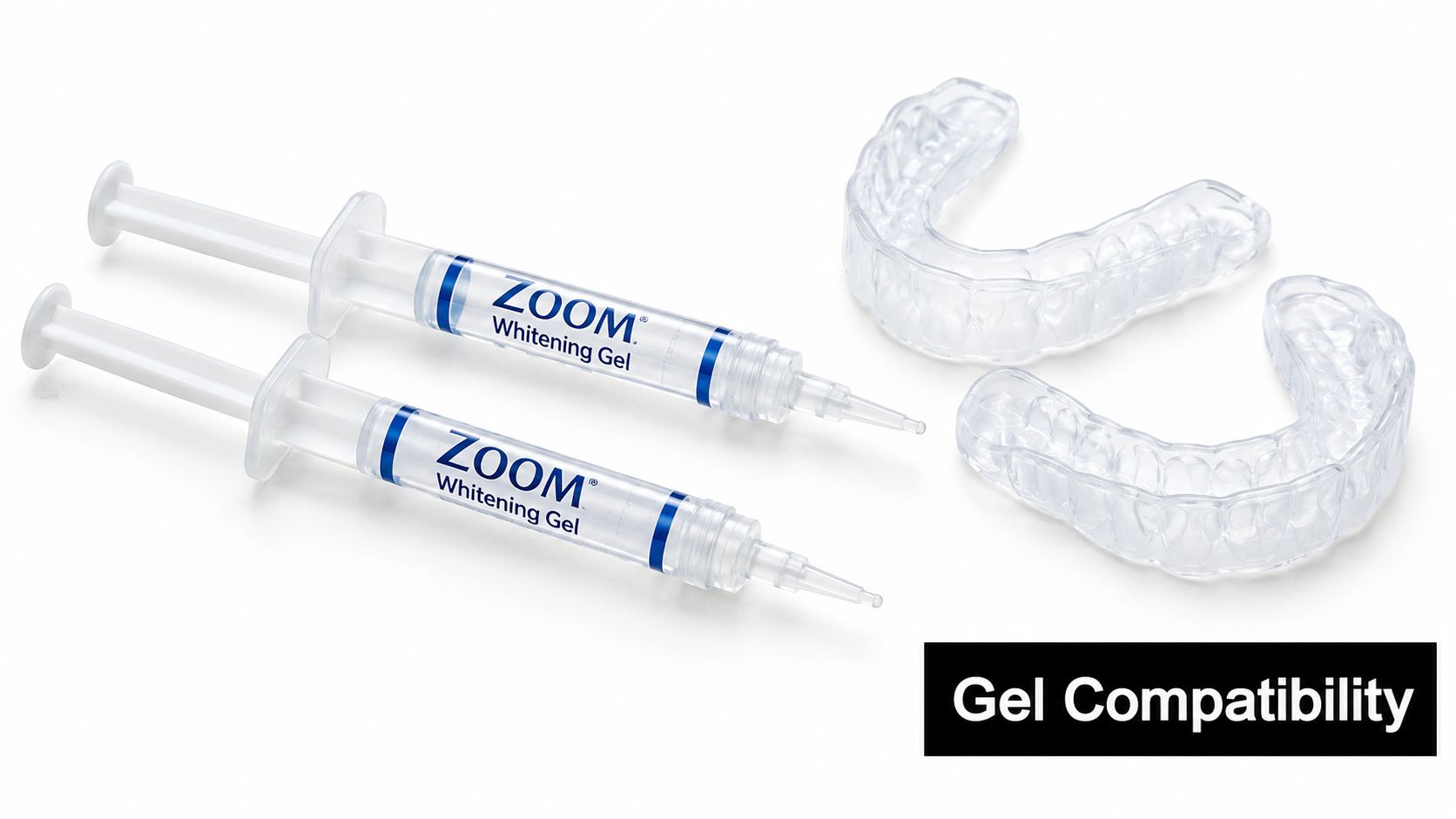 Two syringes of Zoom teeth whitening gel beside two clear dental impression trays on white surface.