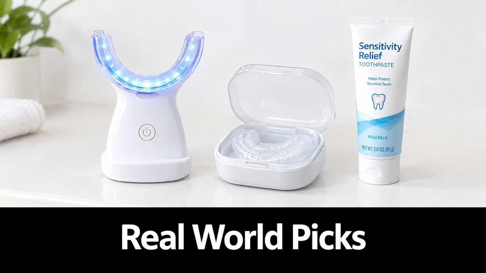 A professional teeth whitening kit featuring a blue UV light device, a plastic tray case, and sensitivity toothpaste.