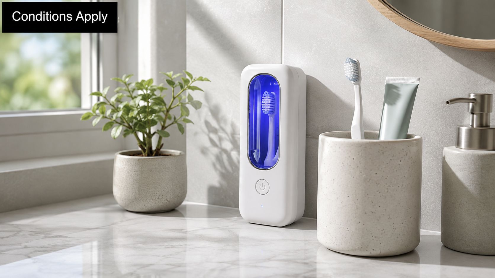 A portable UV toothbrush sanitizer device standing on a marble bathroom counter next to a plant and toothbrush holder.