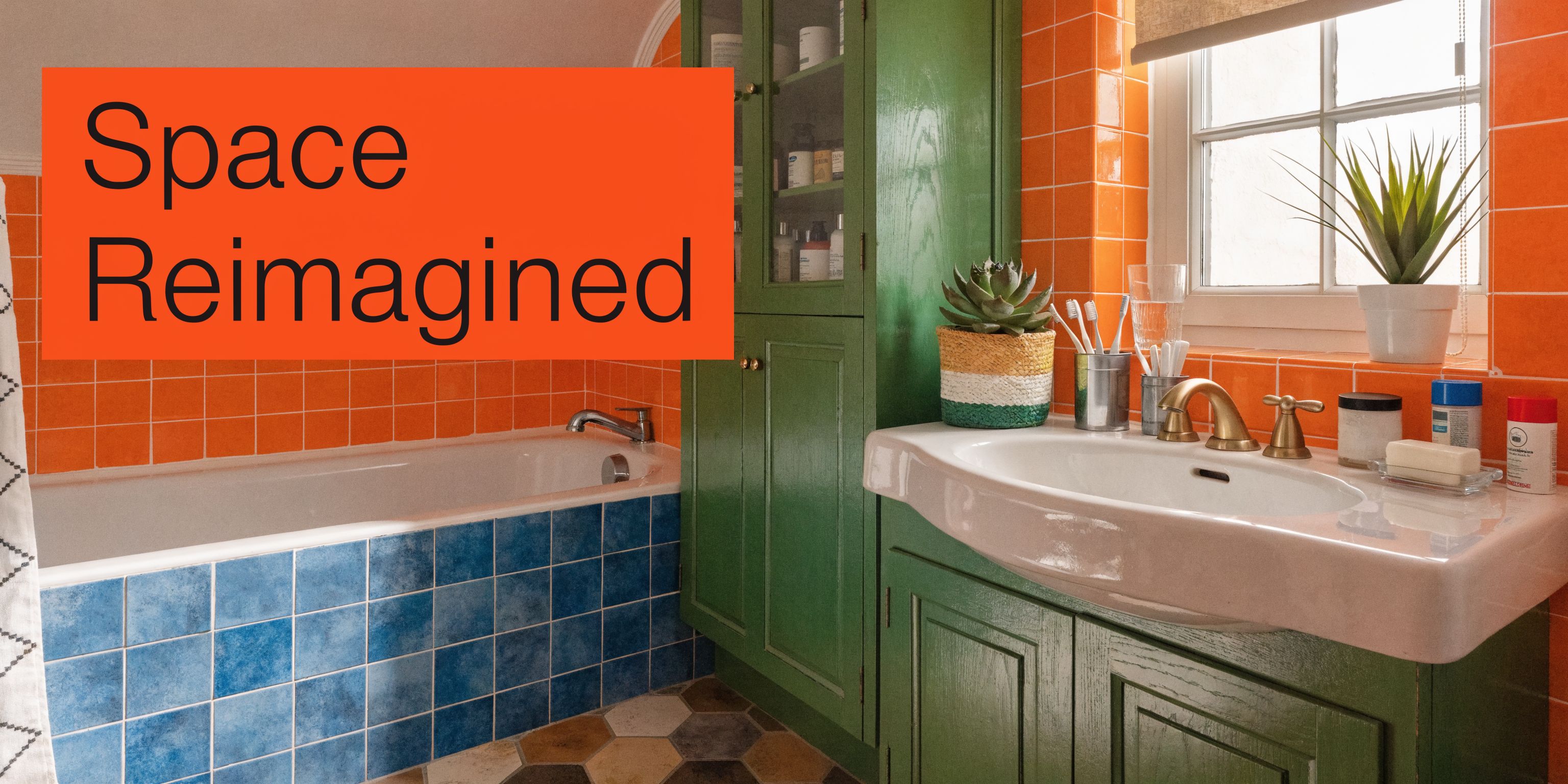 A colorful bathroom featuring vibrant orange wall tiles, a blue tiled bathtub, and green wooden cabinets.