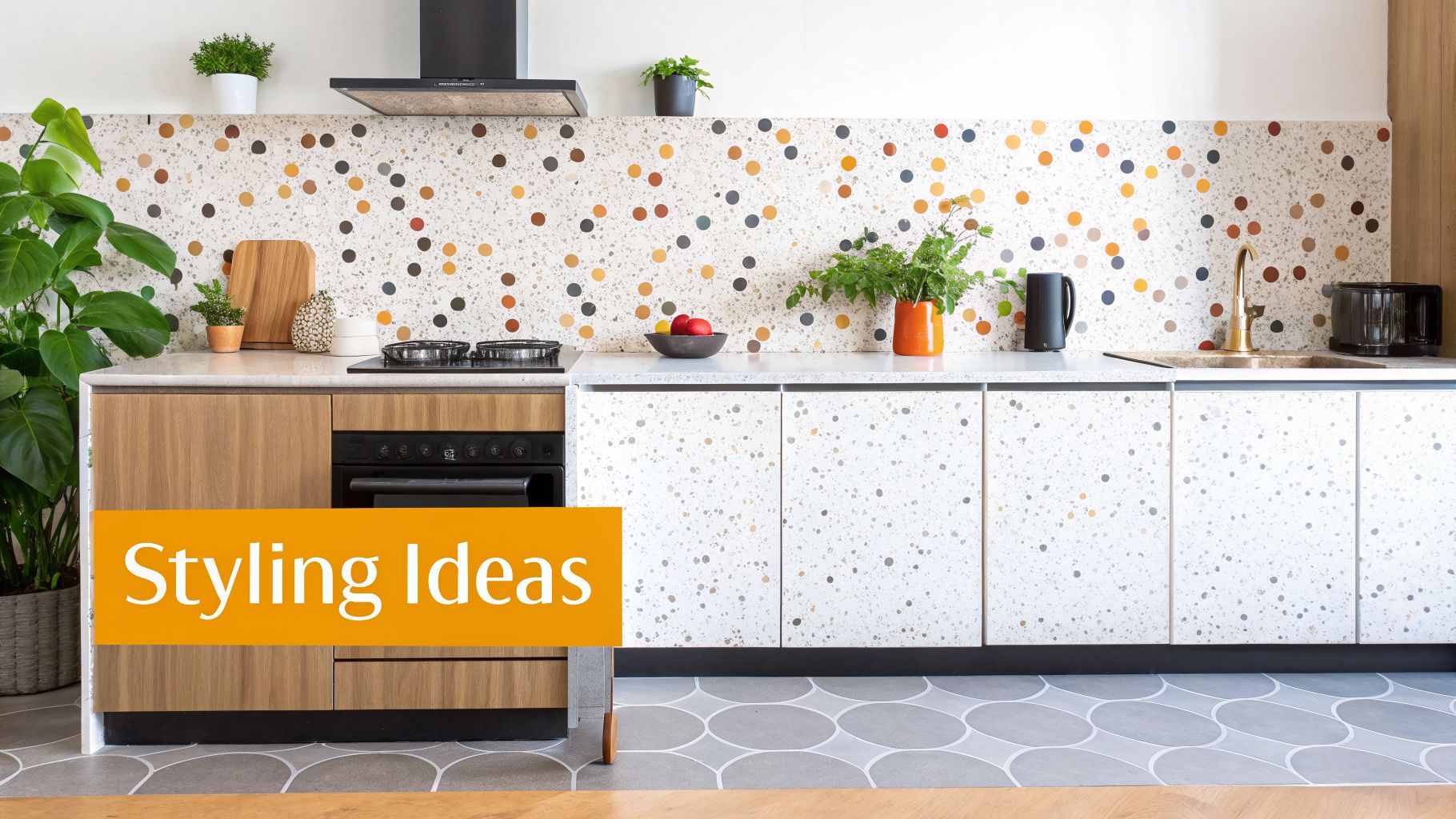 A bright, modern kitchen featuring a vibrant terrazzo-look backsplash, wooden cabinets, and green plants.