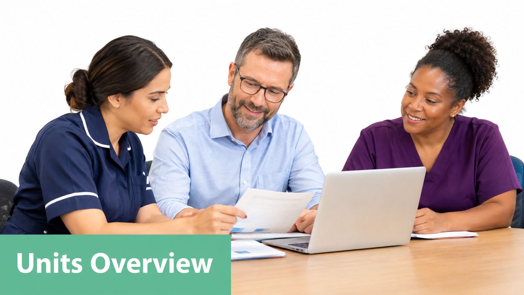 A diverse group of three professionals collaborating on documents and a laptop during a business meeting.