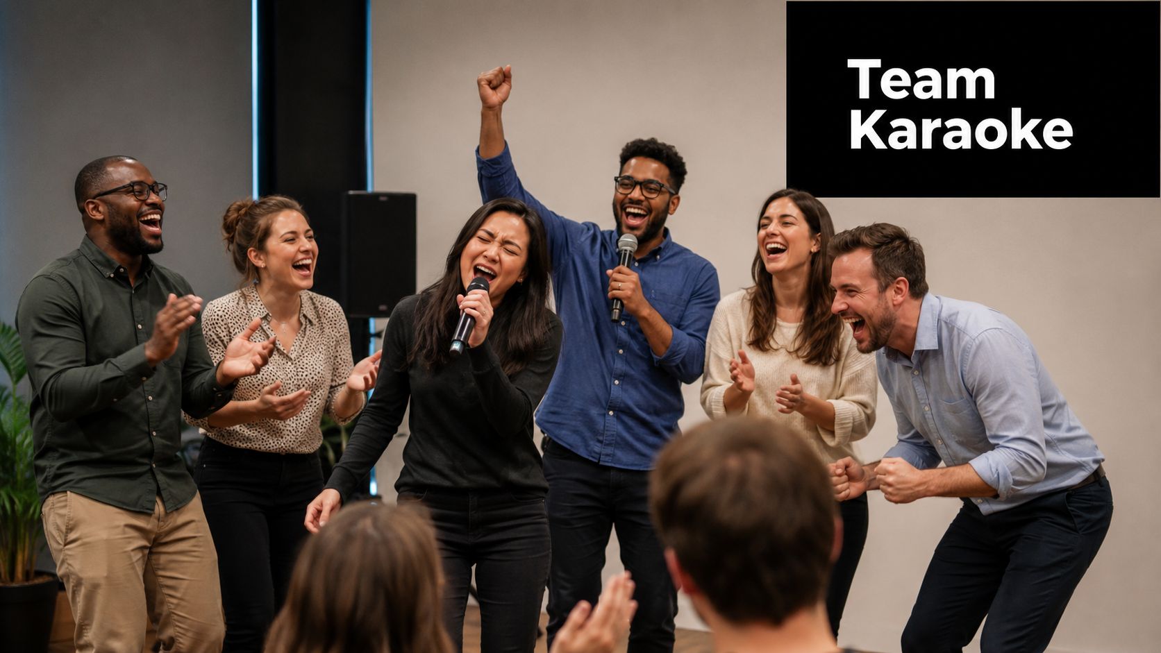 A diverse group of cheerful friends having fun singing and clapping during a lively karaoke party.