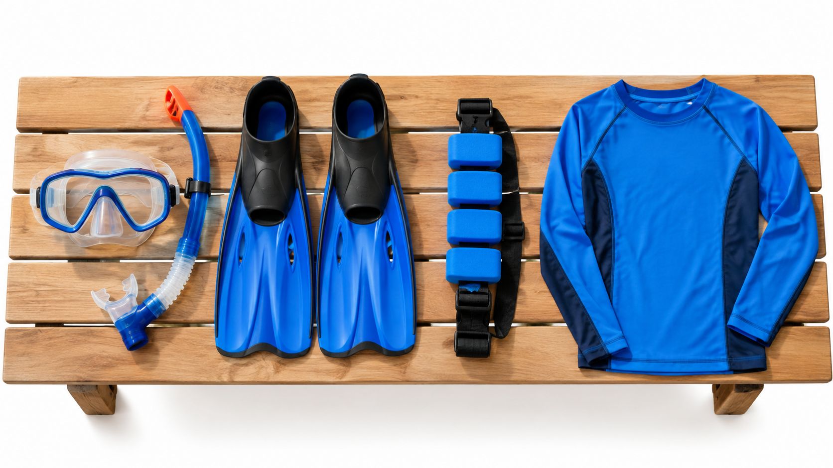 Snorkeling equipment including a mask, snorkel, blue fins, weight belt, and a blue rash guard shirt.