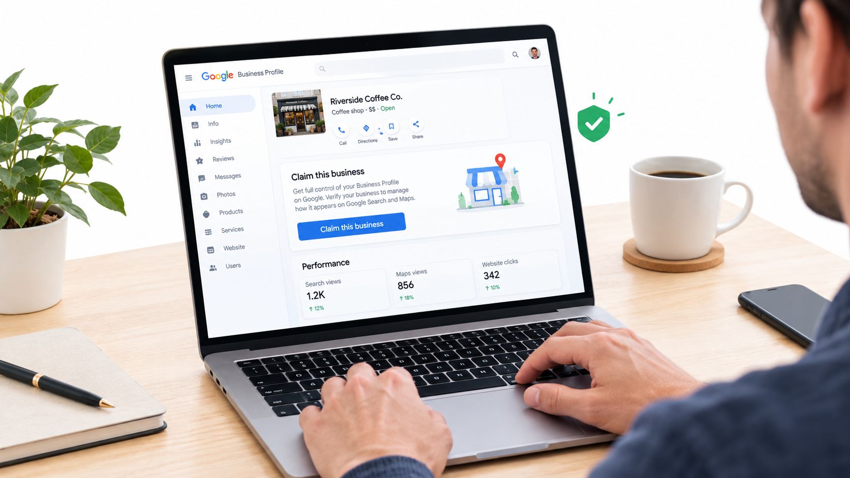 A person using a laptop to view and manage a Google Business Profile for a local coffee shop.
