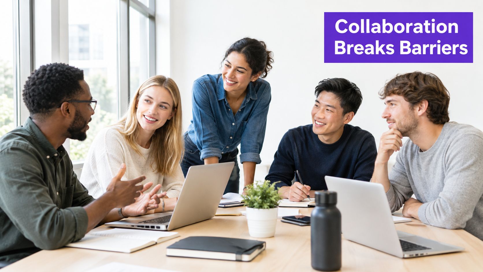 A diverse group of professional colleagues collaborating and having a productive meeting at an office table.