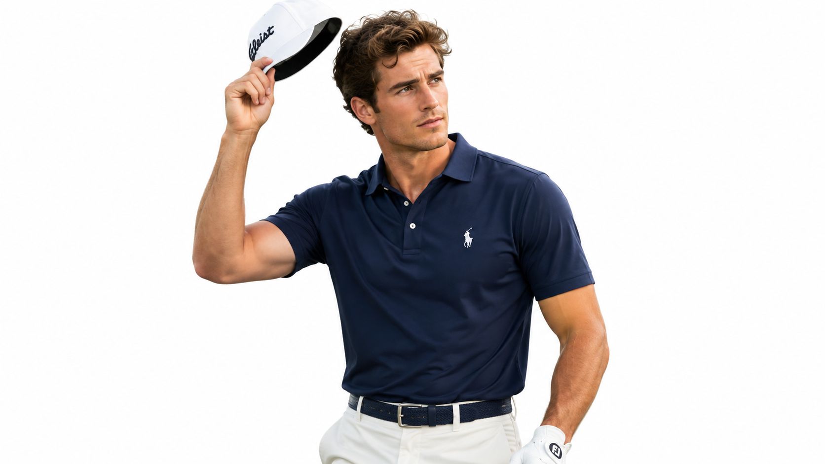 A fit male golfer wearing a navy polo shirt and white golf hat against a white background.
