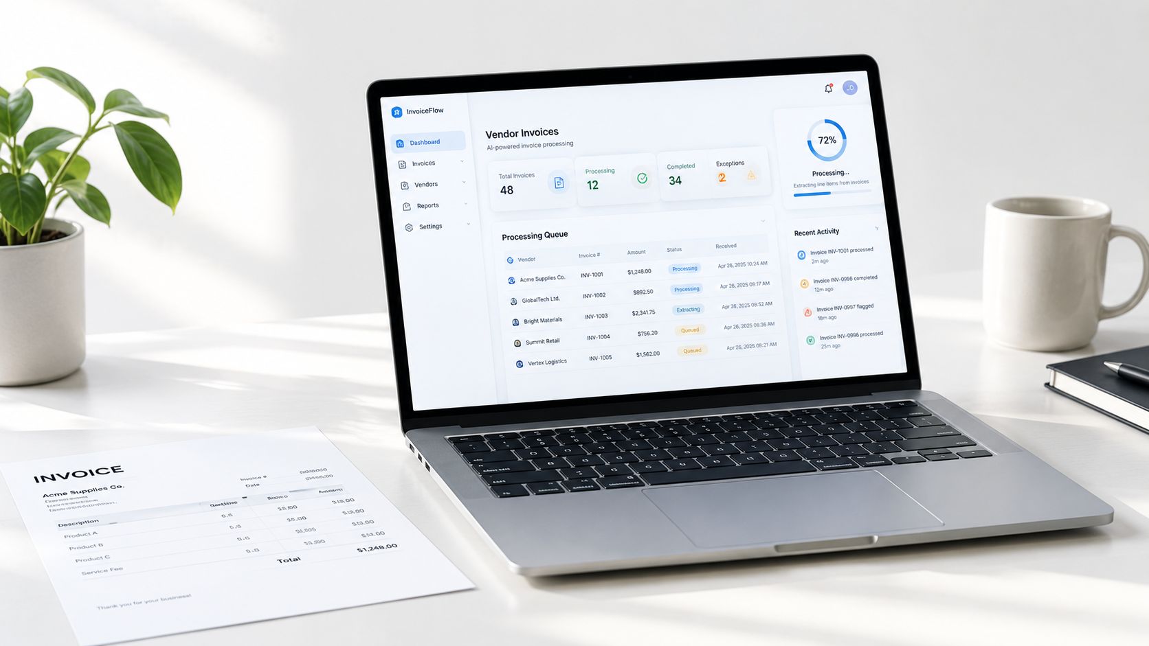 A modern laptop displaying an AI-powered vendor invoice processing dashboard next to a physical paper invoice.