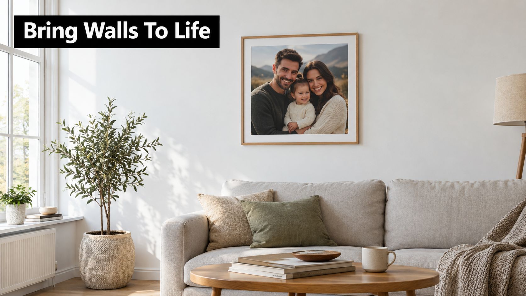 A modern, bright living room features a framed family photograph hanging above a comfortable beige sofa.