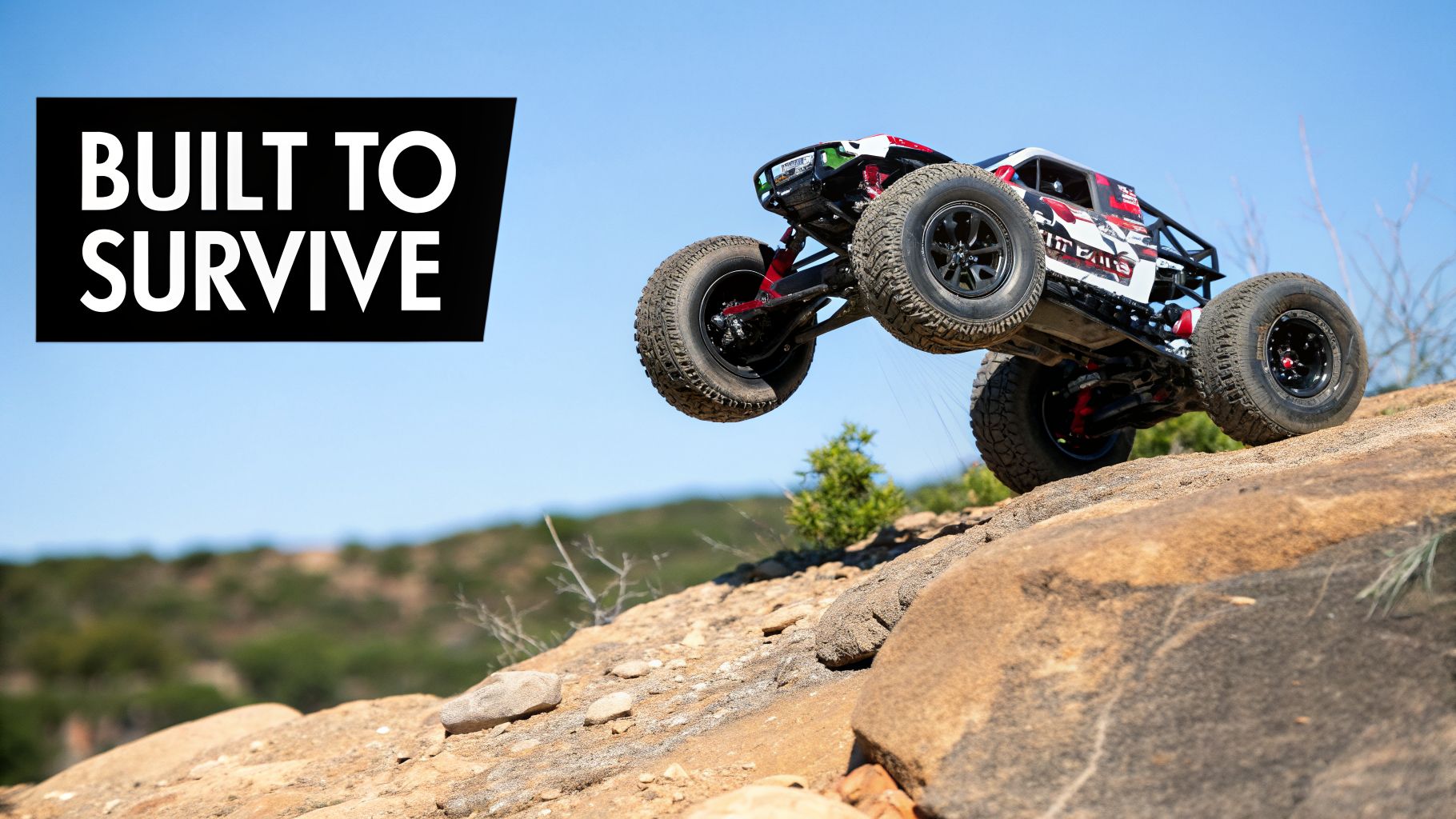 A red and white Arrma Kraton 6S RC car jumping over rocky terrain under a clear blue sky, with text 'BUILT TO SURVIVE'.