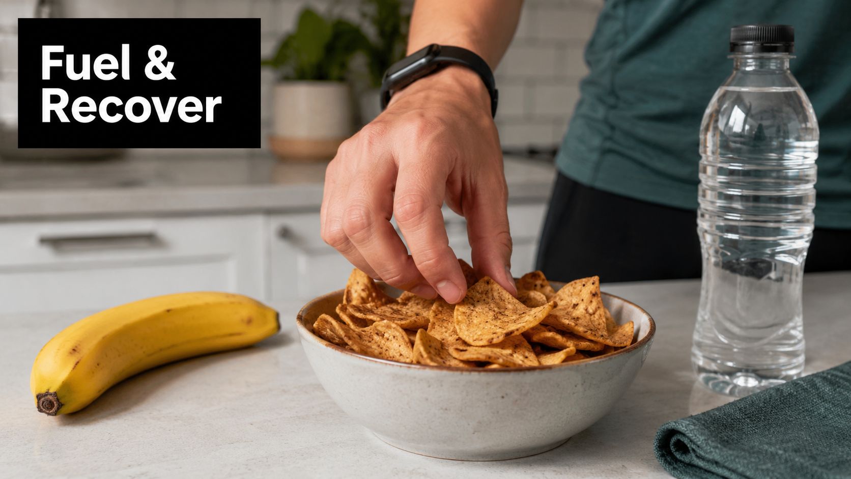 A person picking a tortilla chip from a bowl with a banana and water bottle nearby.