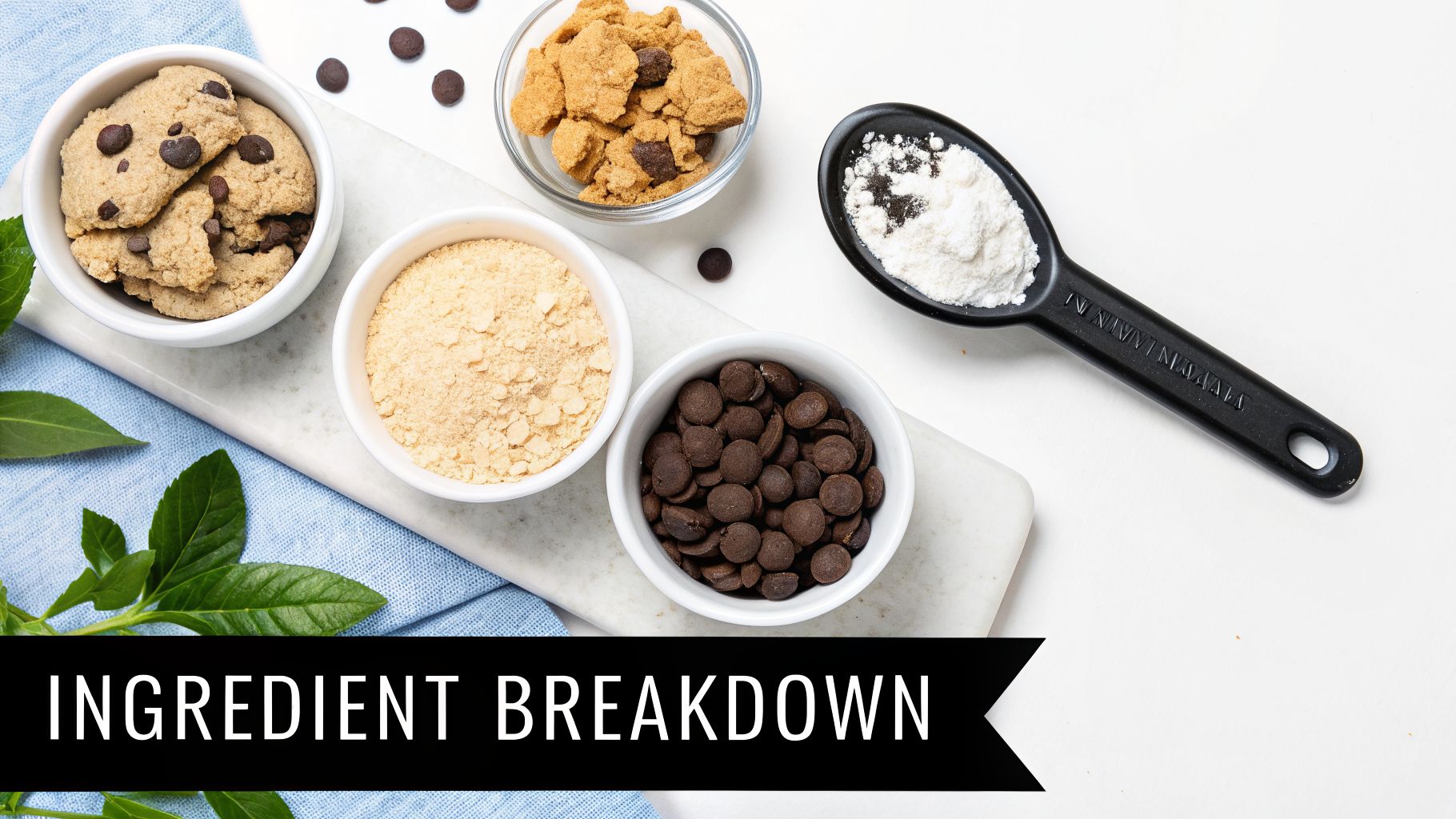 Overhead shot of baking ingredients, including chocolate chip cookies, cookie crumbs, chocolate chips, and white powder.