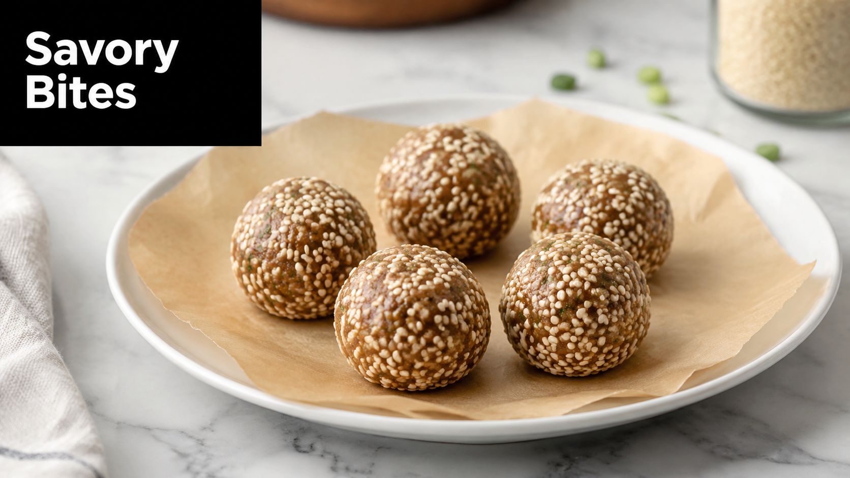 A close-up of five round savory snacks coated in sesame seeds arranged on parchment paper on a plate.