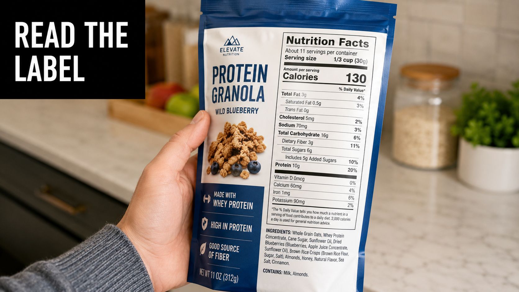 A hand holding a bag of Elevate Nutrition Wild Blueberry Protein Granola showing the nutrition facts label.