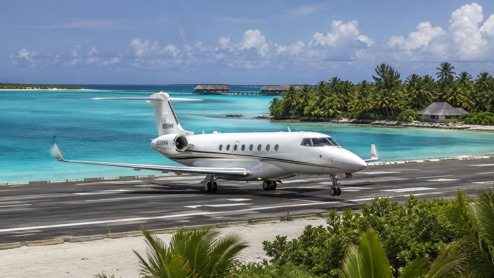 A private luxury jet landing on a runway surrounded by turquoise ocean waters and tropical palm trees.
