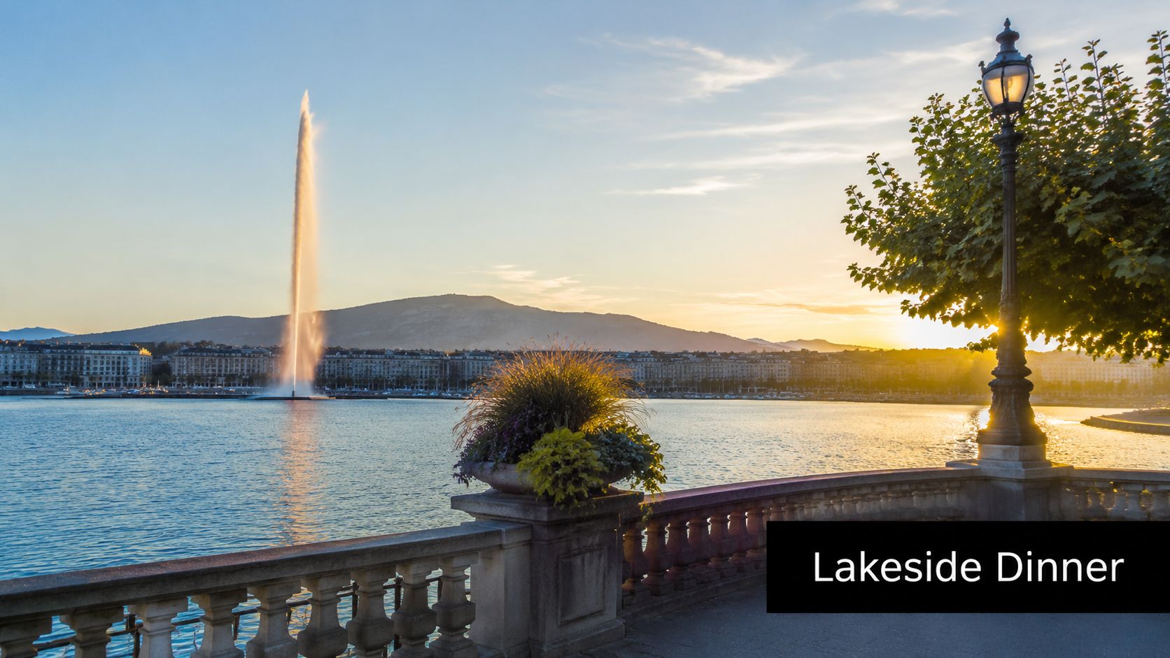 A scenic view of the Jet d'Eau fountain on Lake Geneva during a beautiful golden sunset.