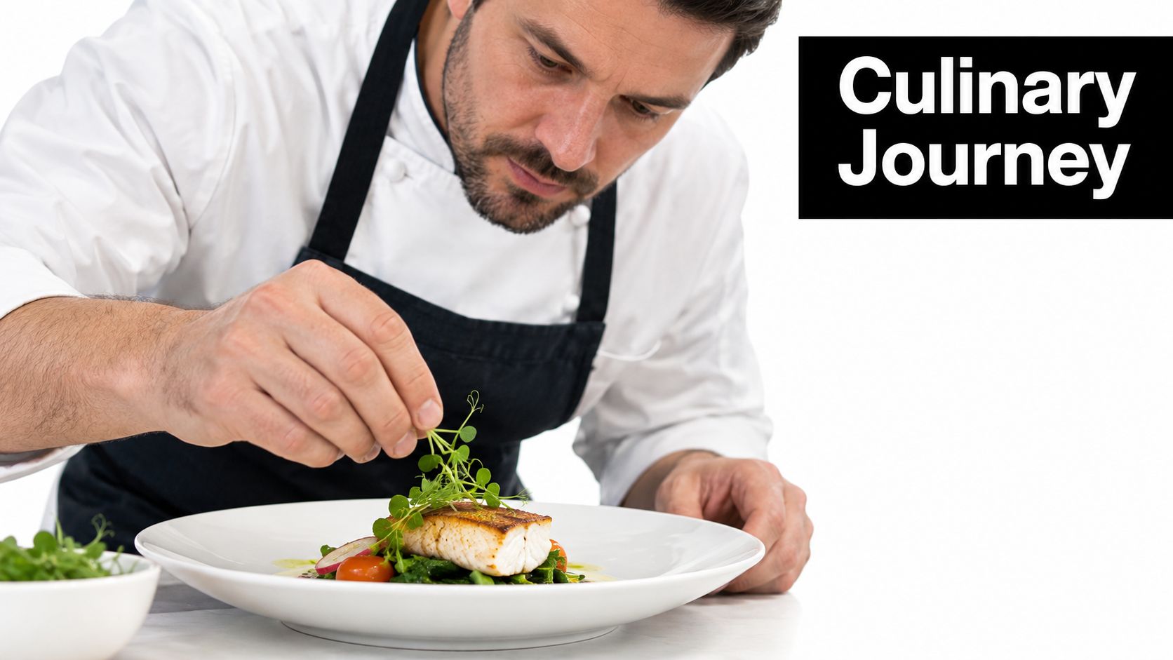A professional chef carefully garnishes a beautifully plated fish dish with fresh green herbs.