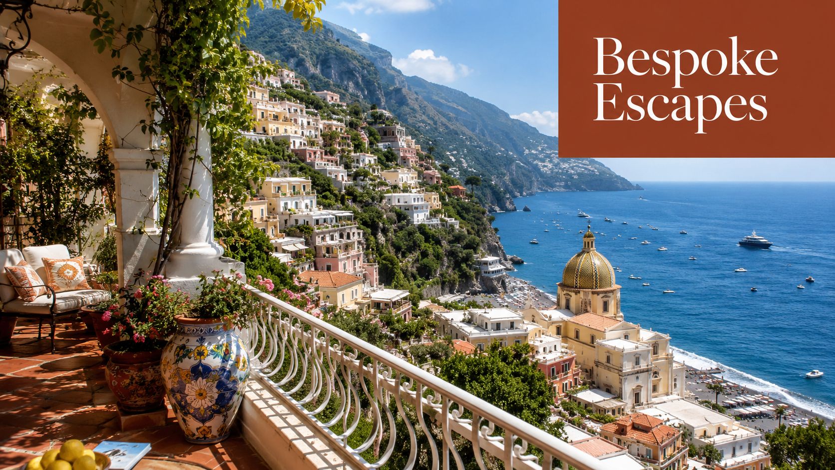A luxurious balcony terrace overlooking the coastal town of Positano and the sparkling Tyrrhenian Sea in Italy.