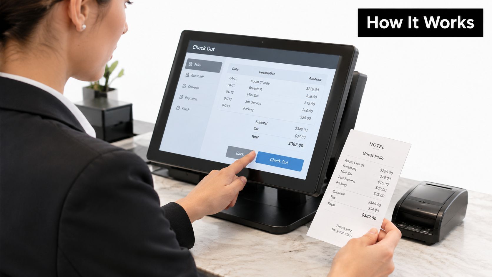 A hotel staff member processing a guest checkout on a touch screen terminal at the front desk.