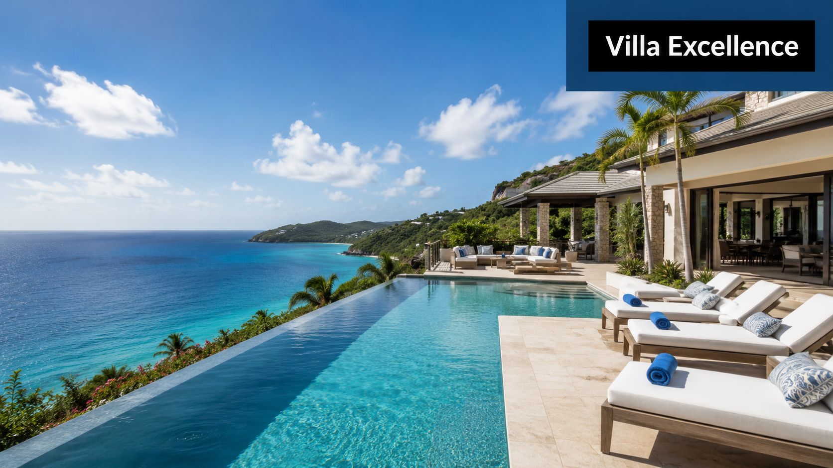 A stunning infinity pool overlooking the blue Caribbean sea from a luxury private villa terrace.