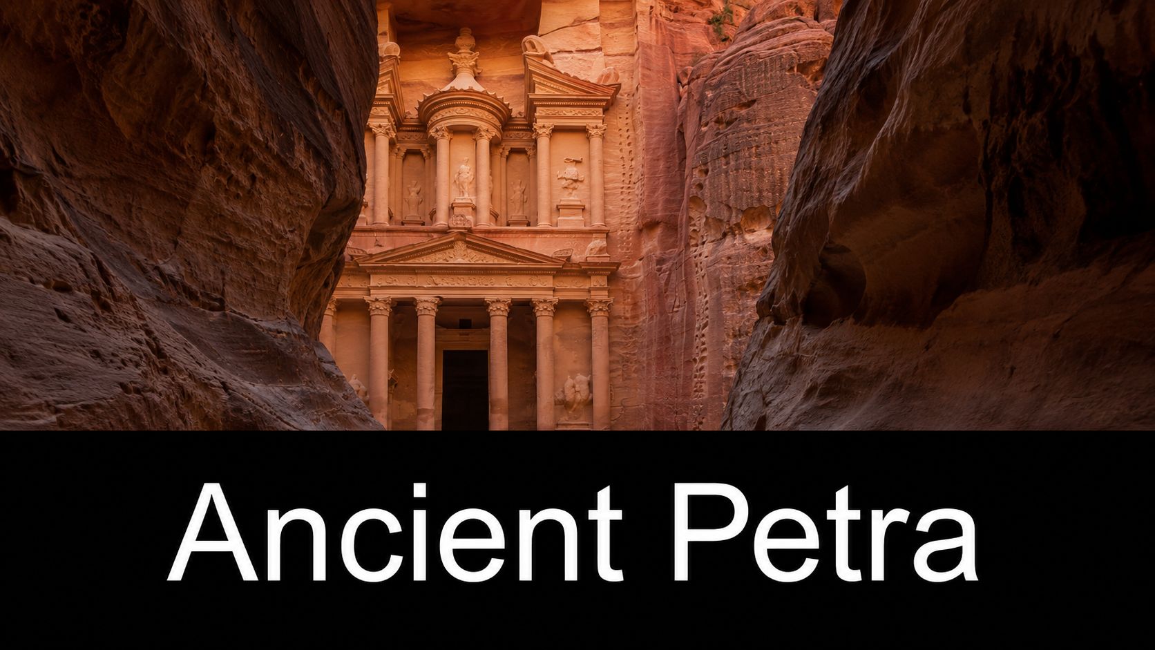The ancient Treasury building carved into pink sandstone cliff walls at the historic archaeological site of Petra, Jordan.