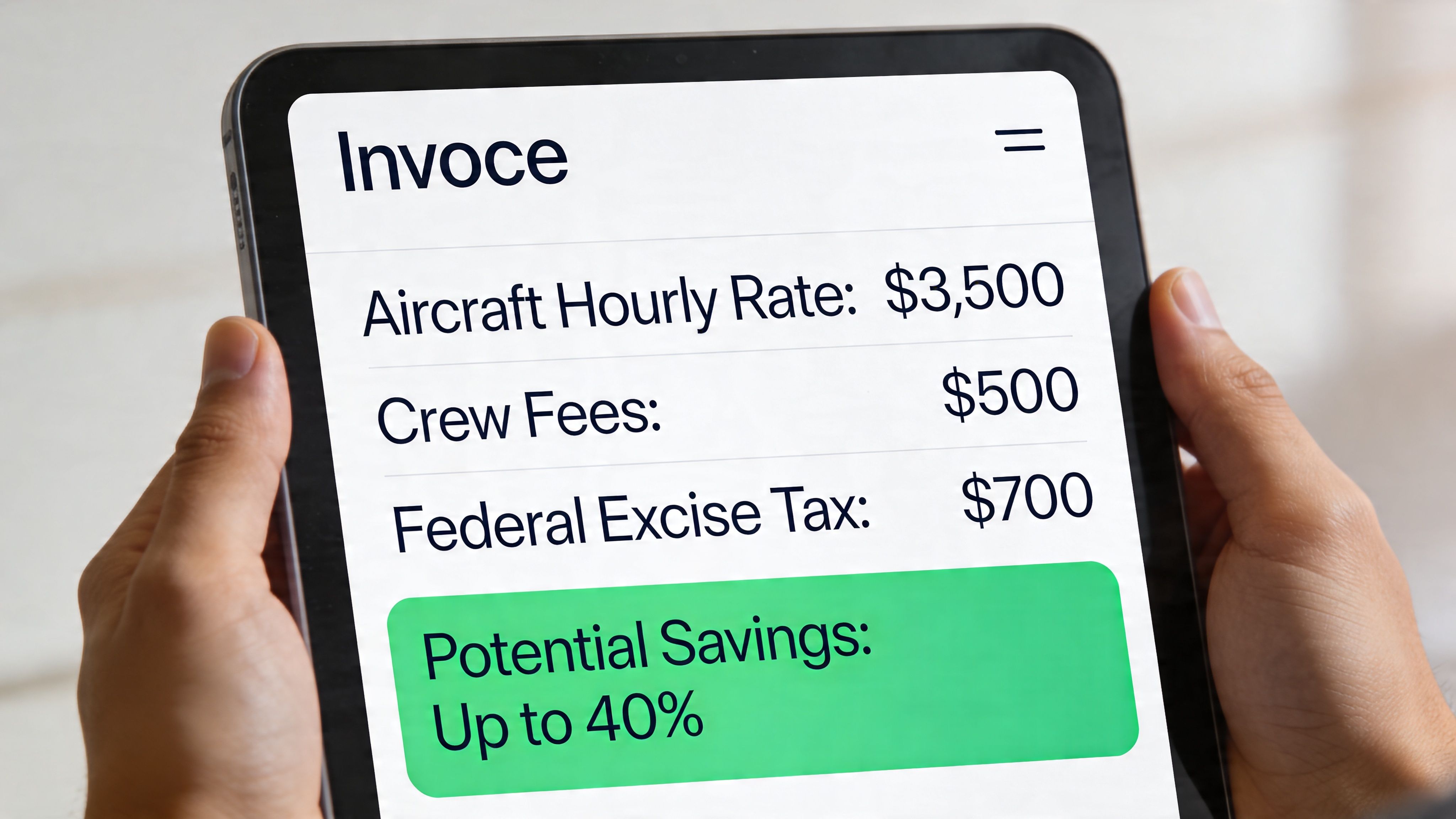 A person holding a tablet displaying a digital invoice for private aviation services including hourly rates and taxes.