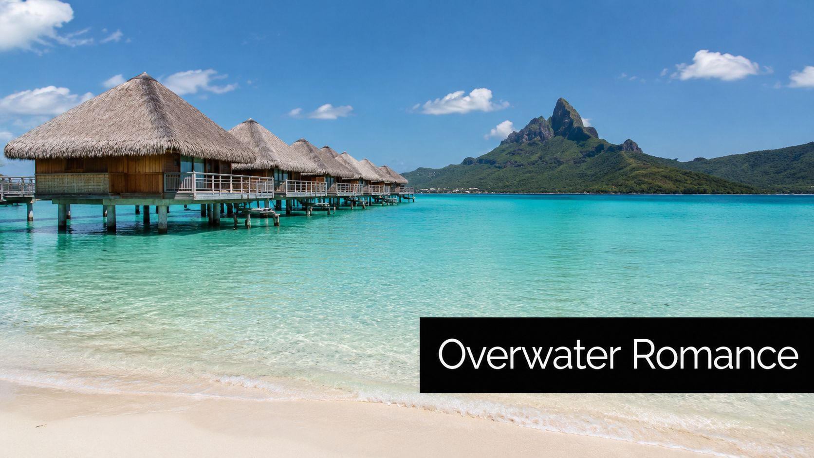 A row of luxury overwater bungalows in a tropical turquoise lagoon with a mountain background in Bora Bora.