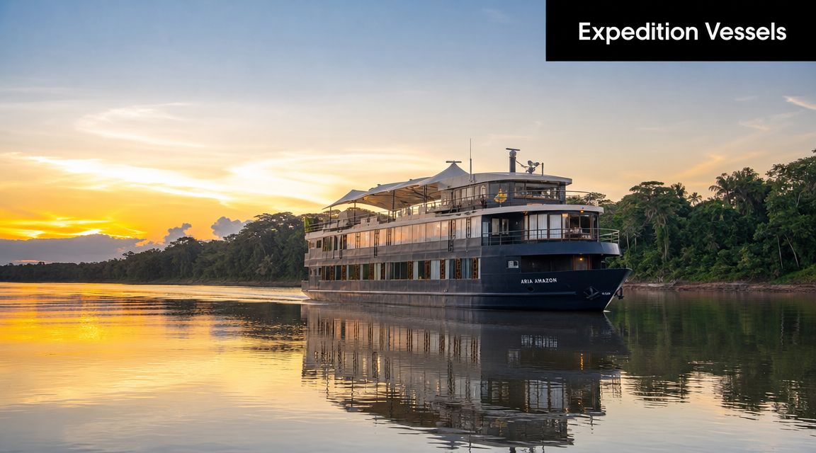 The Aria Amazon expedition cruise ship floating on a calm river during a beautiful golden sunset.