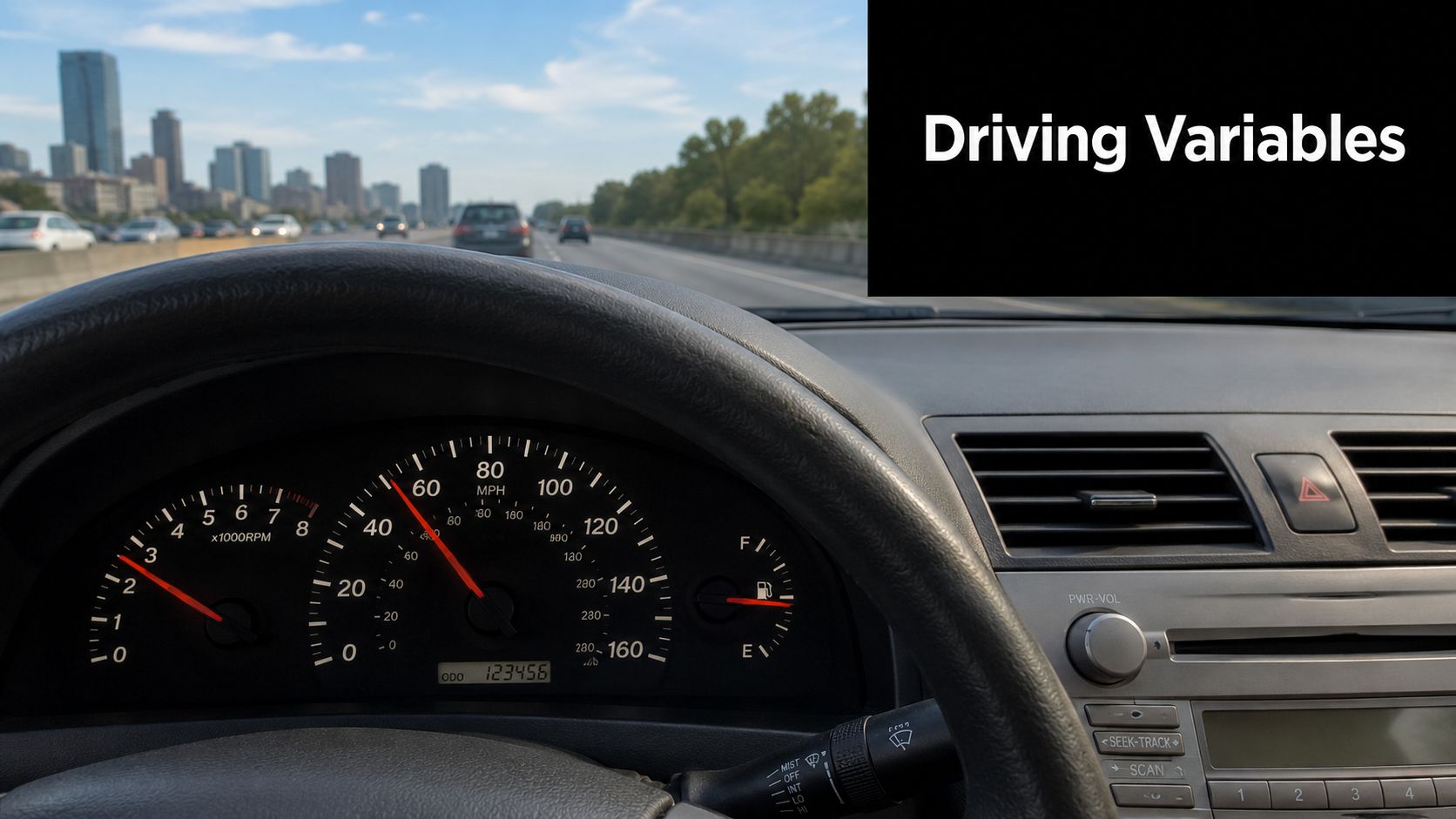 A first-person view from the driver's seat of a 2007 Toyota Camry cruising on a highway.