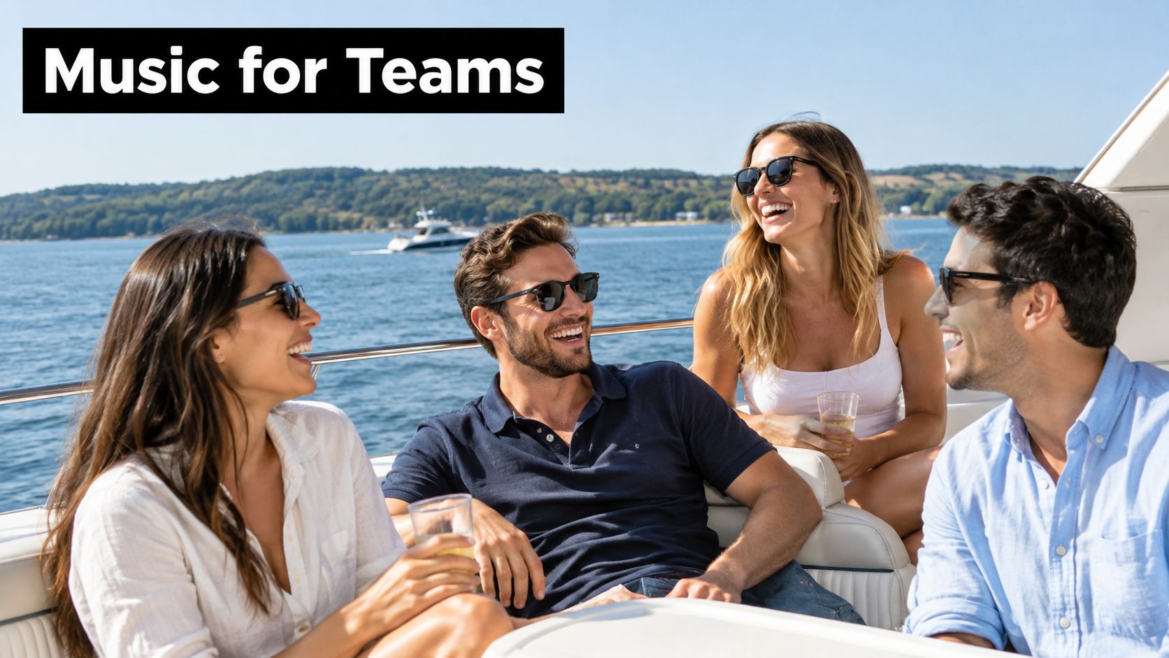 A group of happy young colleagues laughing and chatting while enjoying a boat trip together.