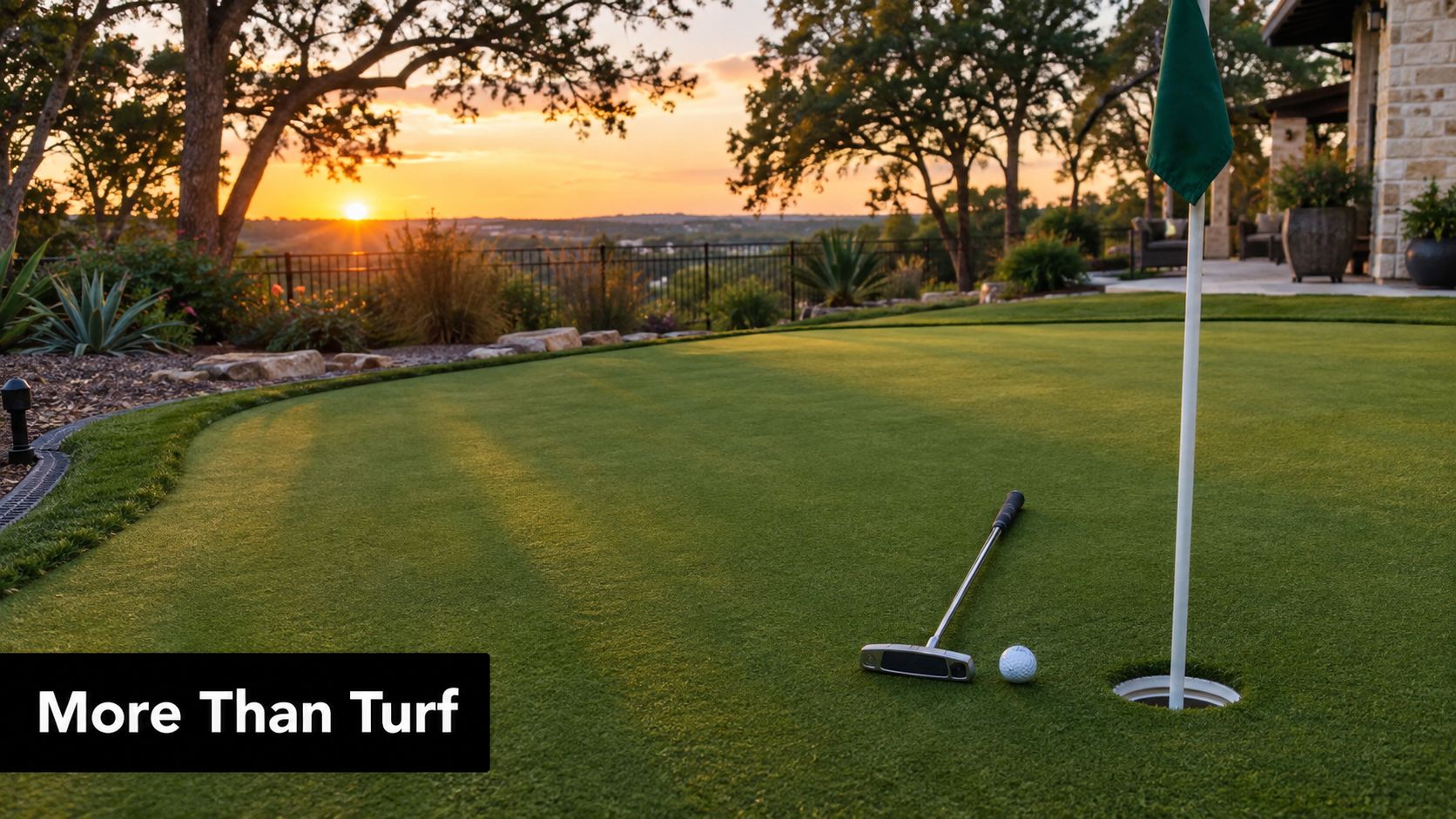 A serene backyard putting green with a golf ball and putter at sunset with scenic views.