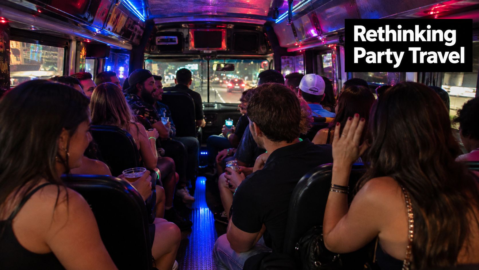 A group of young people enjoying a night out inside a lit party bus while traveling.