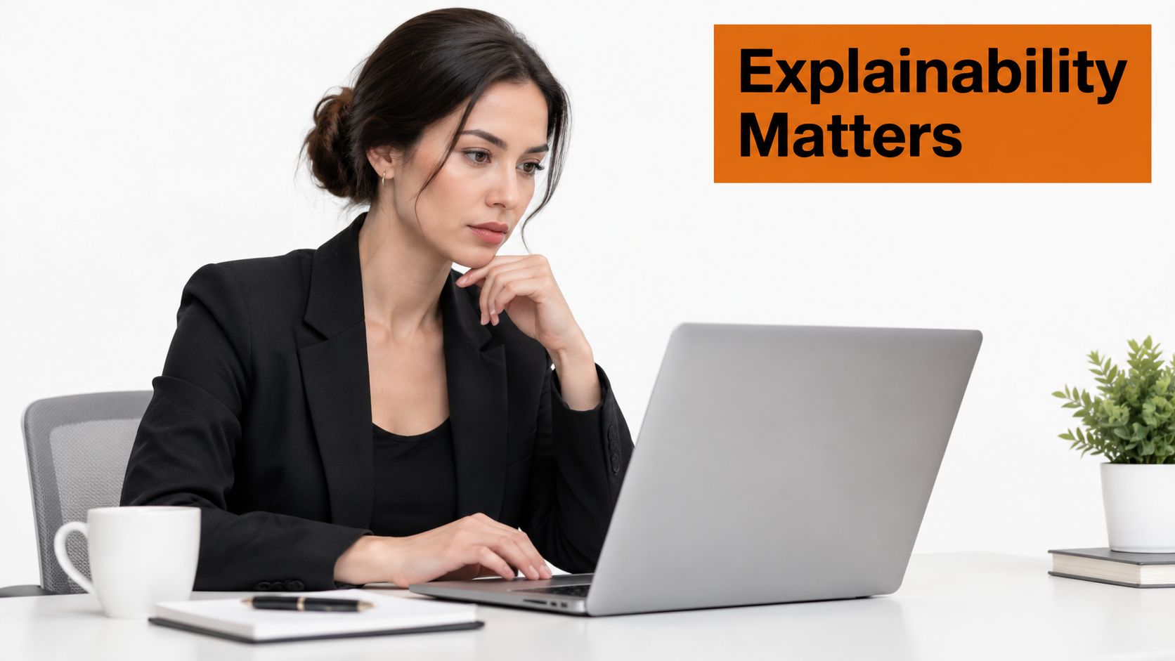 A professional woman in a business suit analyzing data on a laptop, emphasizing the importance of explainability.