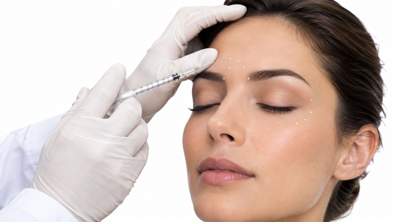 A dermatologist performing a facial cosmetic injection on a woman's forehead to reduce signs of aging.