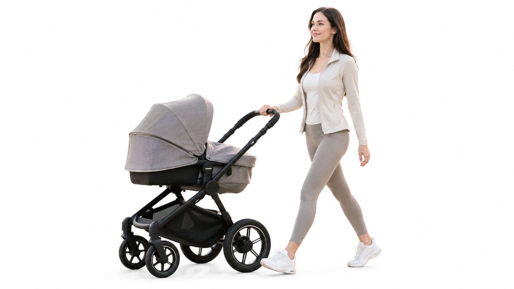 A fit woman pushing a modern gray baby stroller while walking against a plain white background.