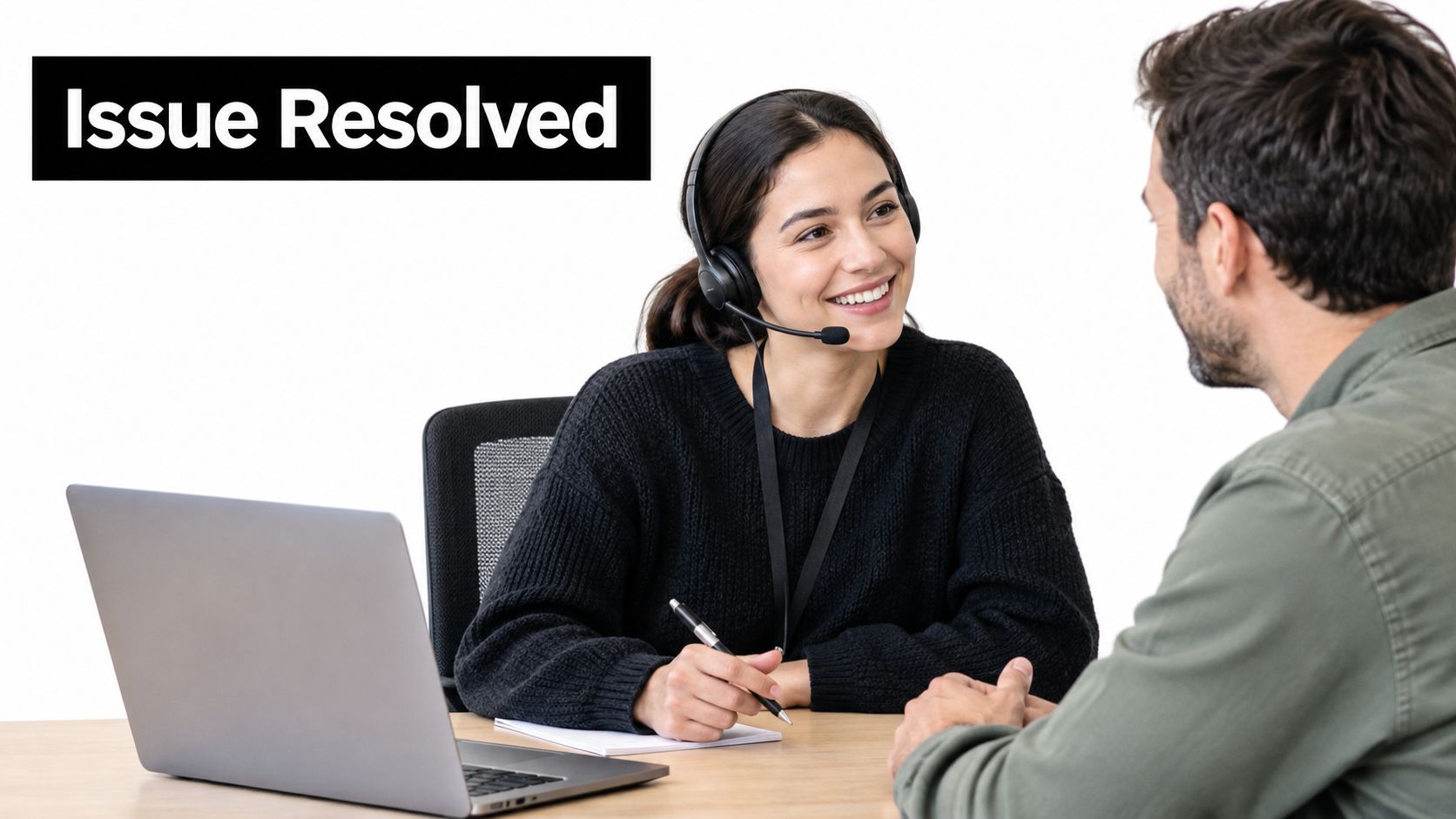 A professional woman wearing a headset smiling and talking to a client during a customer support meeting.