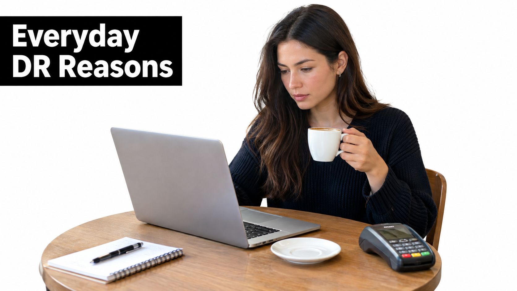 A young woman sits at a wooden table with a laptop, a coffee cup, and a card machine.