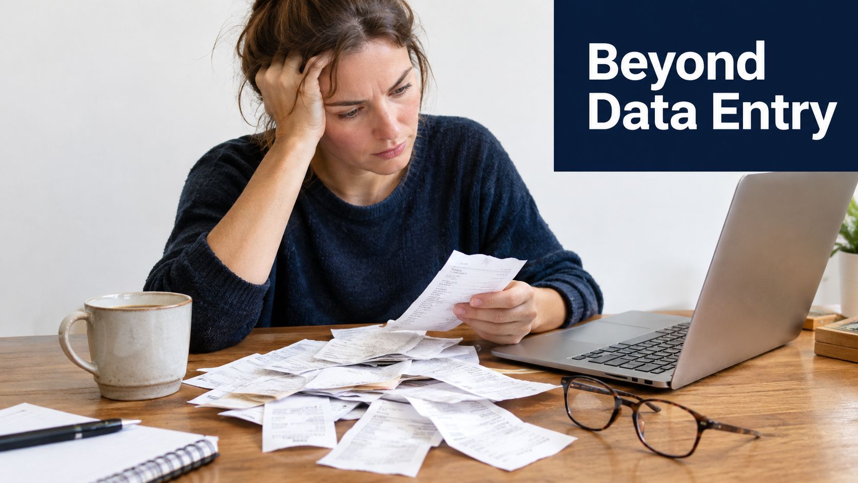 A woman looks stressed while organizing a large pile of paper receipts next to her laptop.