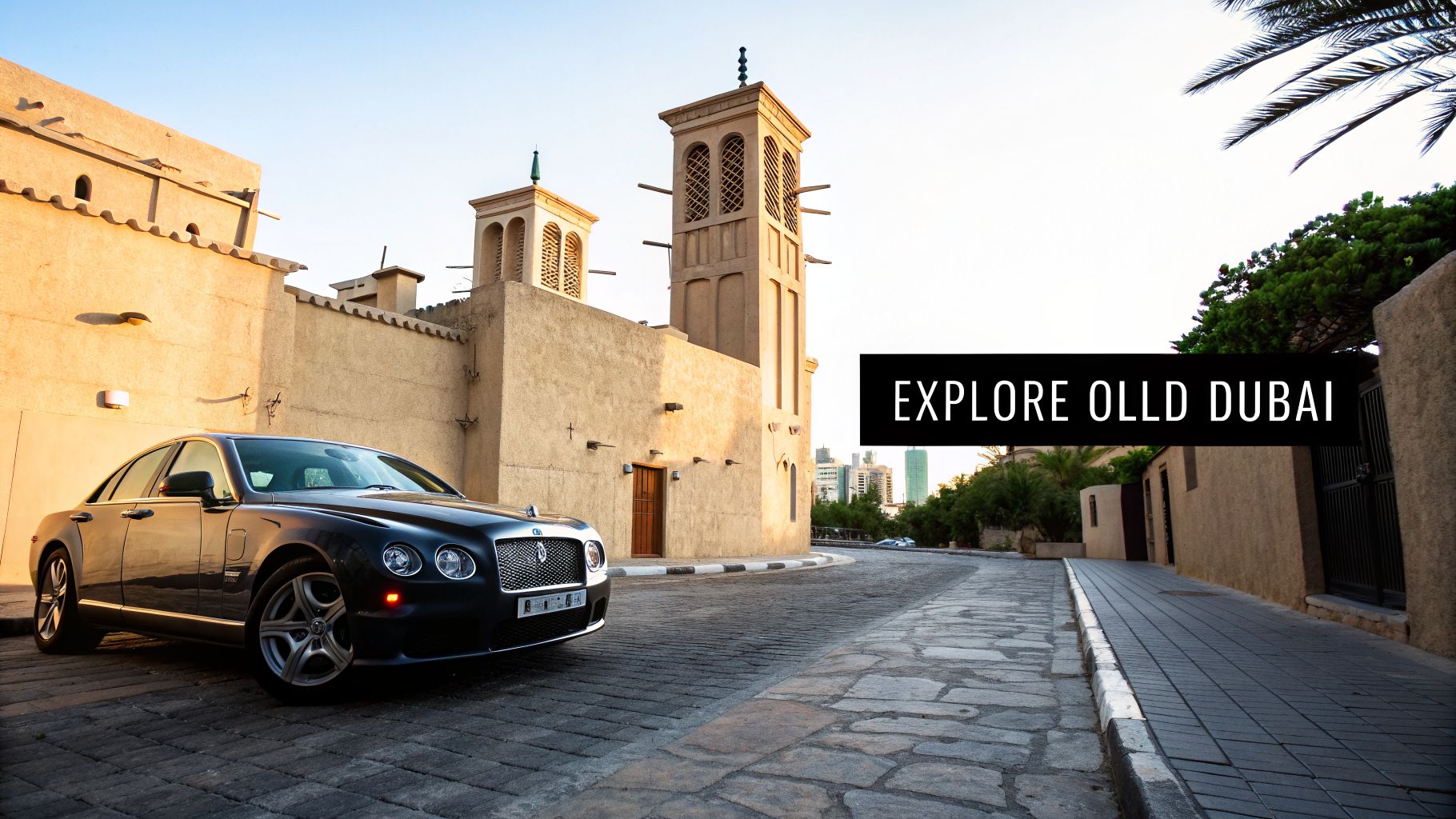 Your Guide to Bur Dubai Maps 1 A luxury car parked on a cobblestone street in front of traditional Emirati buildings and modern skyline.