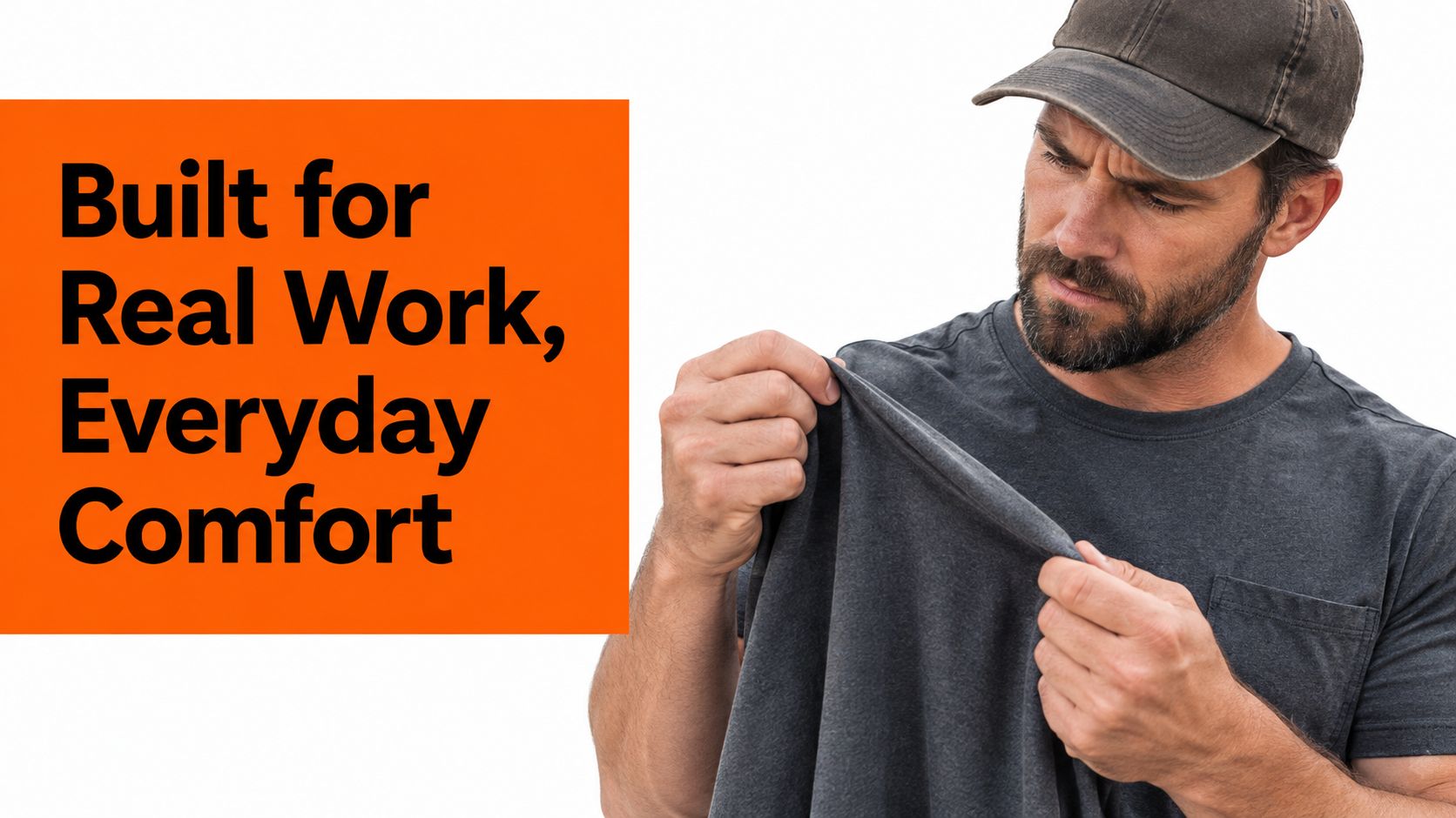 A bearded man in a baseball cap inspecting the high-quality fabric of a dark grey workwear shirt.