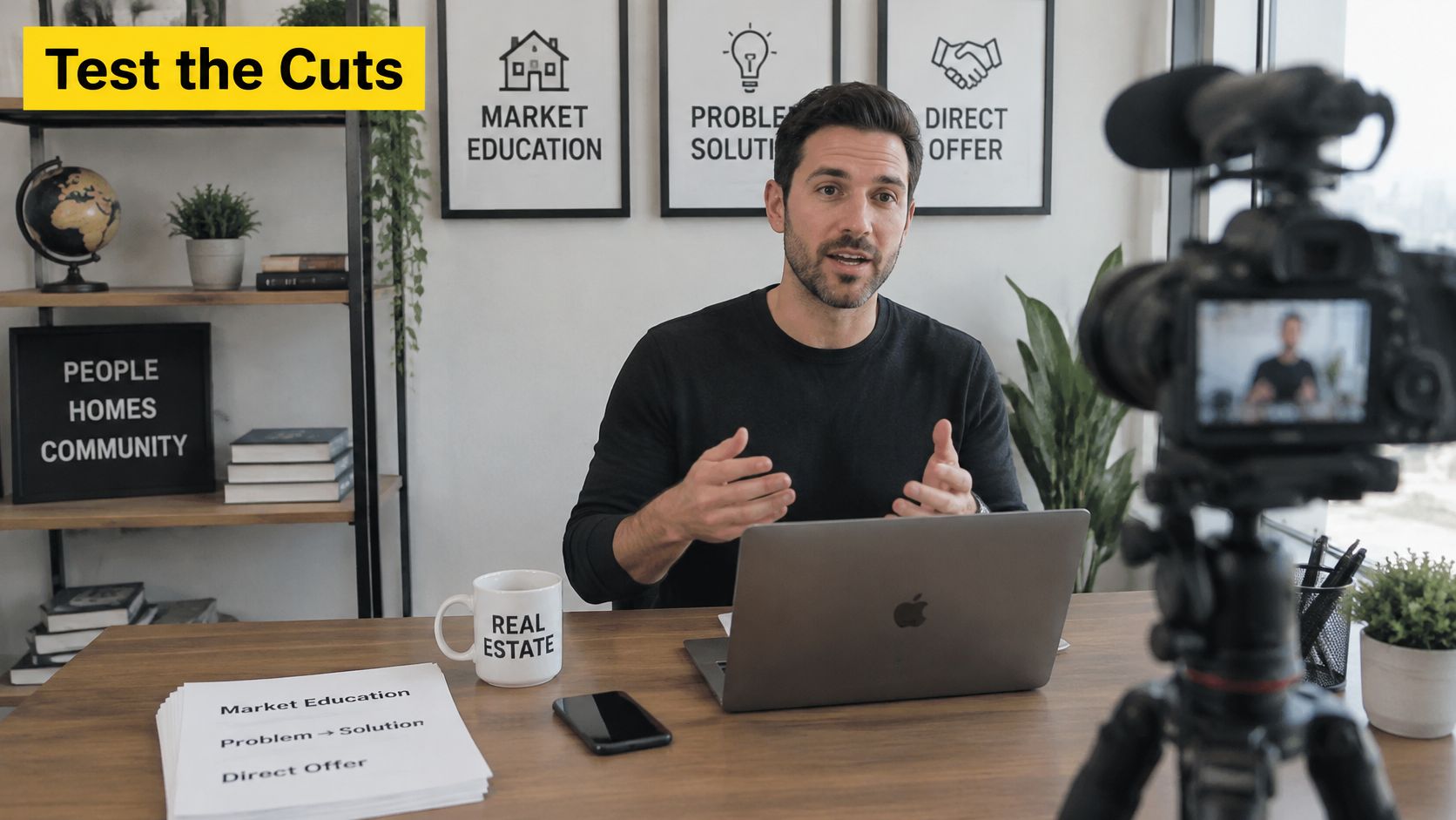 A real estate expert recording educational video content for his YouTube channel while sitting at his desk.