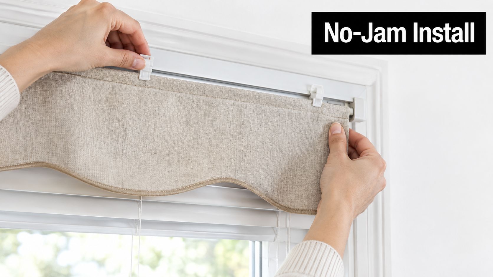 A person installing a beige fabric window valance onto white blinds using white mounting clips.