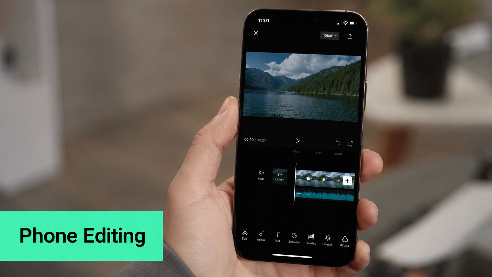 A person holding a smartphone showing a video editing app with a mute option selected.