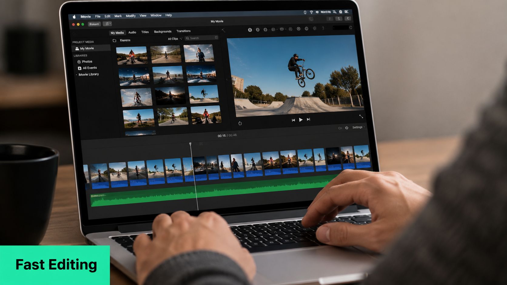 A person editing a BMX video project on a MacBook Pro using the iMovie software application.
