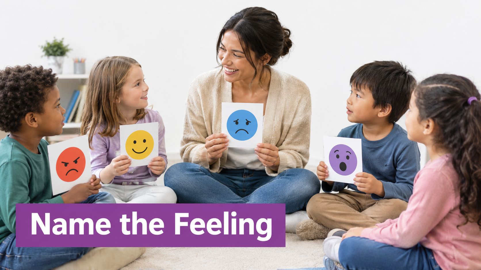 A teacher sitting with four young children on the floor, holding up emotion flashcards in a classroom.