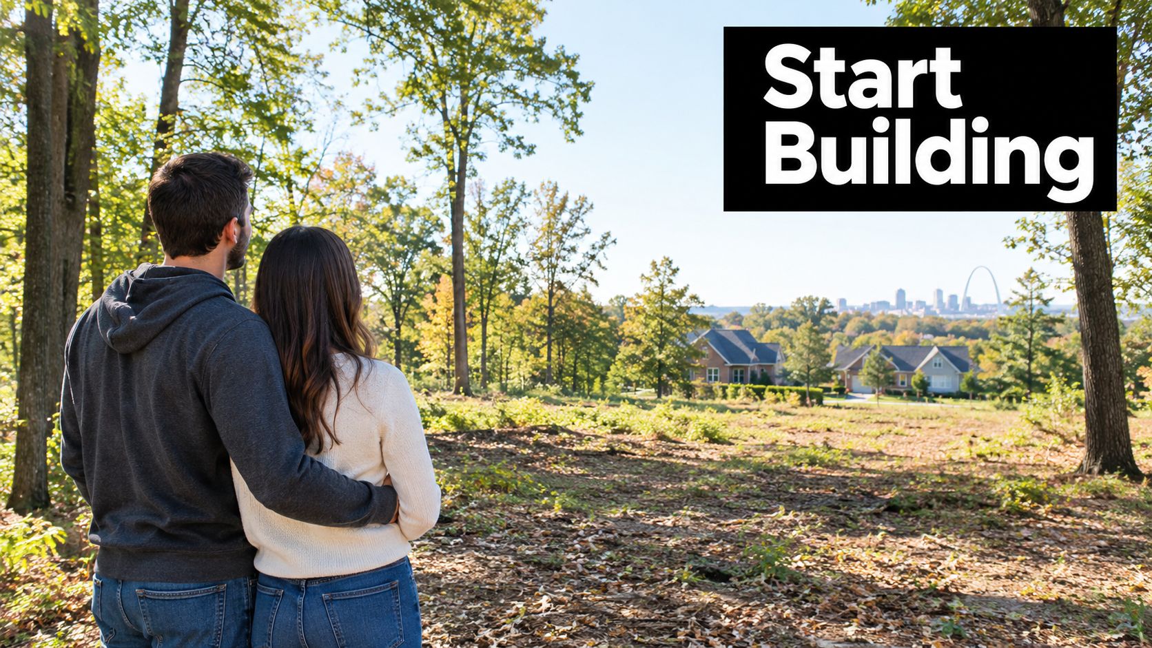 A couple standing in a wooded lot overlooking the St. Louis skyline and suburban homes.
