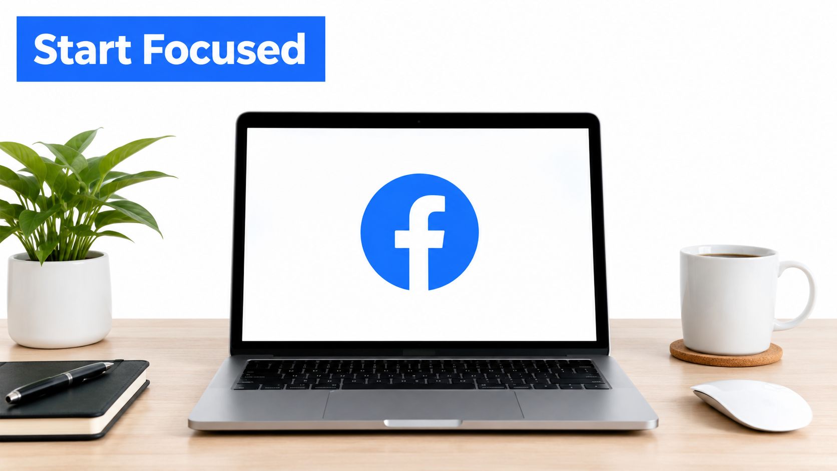 A modern desk workspace with a laptop displaying the Facebook logo on a white screen.