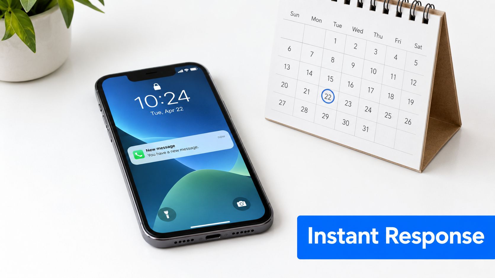 A smartphone on a white desk next to a calendar with the twenty-second circled, symbolizing scheduling.