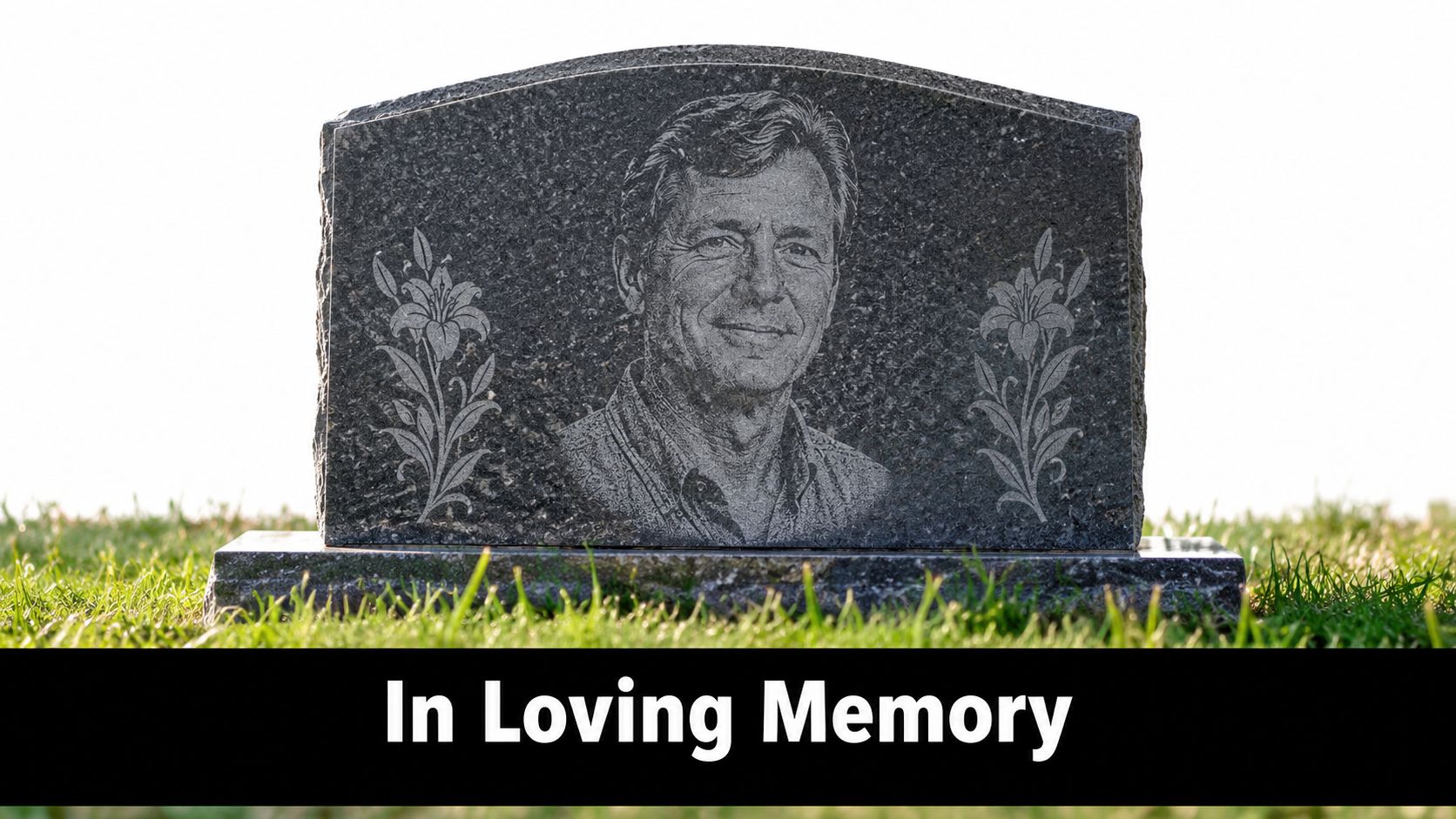 A custom granite gravestone featuring a laser engraved portrait of a man and floral designs.